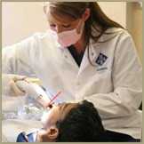 patient on dentist chair having a cosmetic dentistry procedure